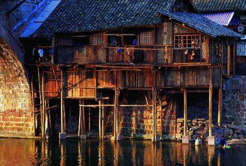 吊脚楼的由来和发展,土家族吊脚楼的位置,作用,材料,结构和文化内涵的关系图4